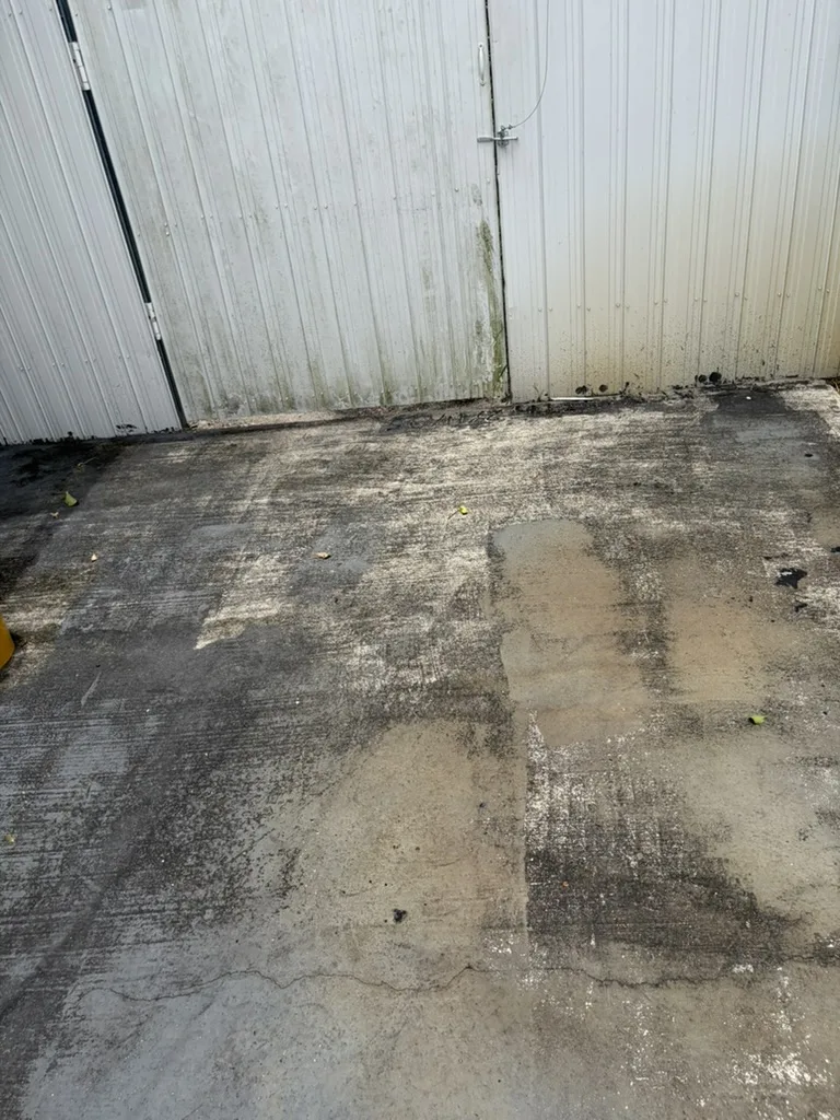 Bare cracked concrete driveway and walkway before epoxy installation